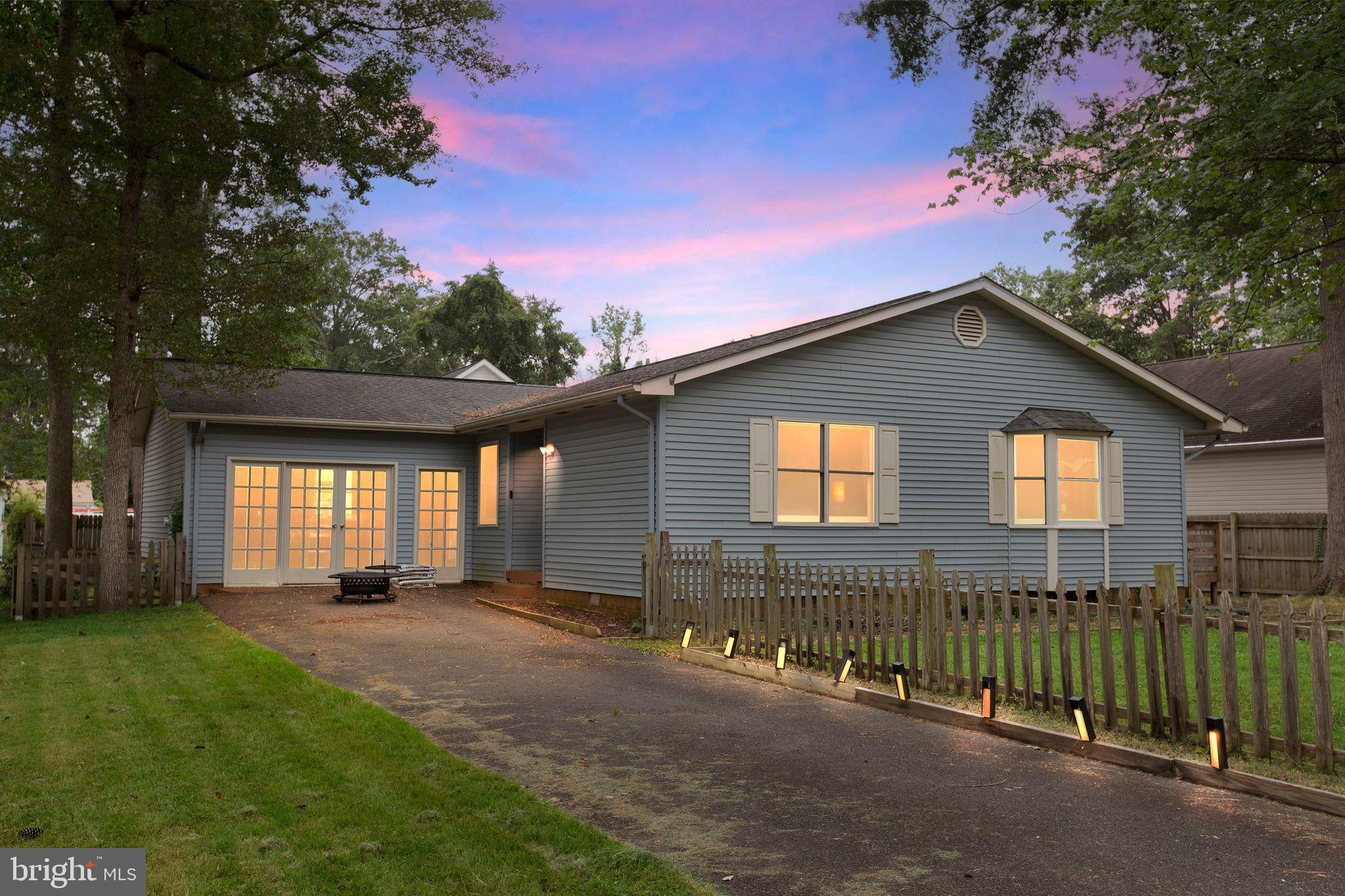 128 7th Street Colonial Beach, VA 22443 - Photo 3 of 32 a backyard of a house with lots of green space