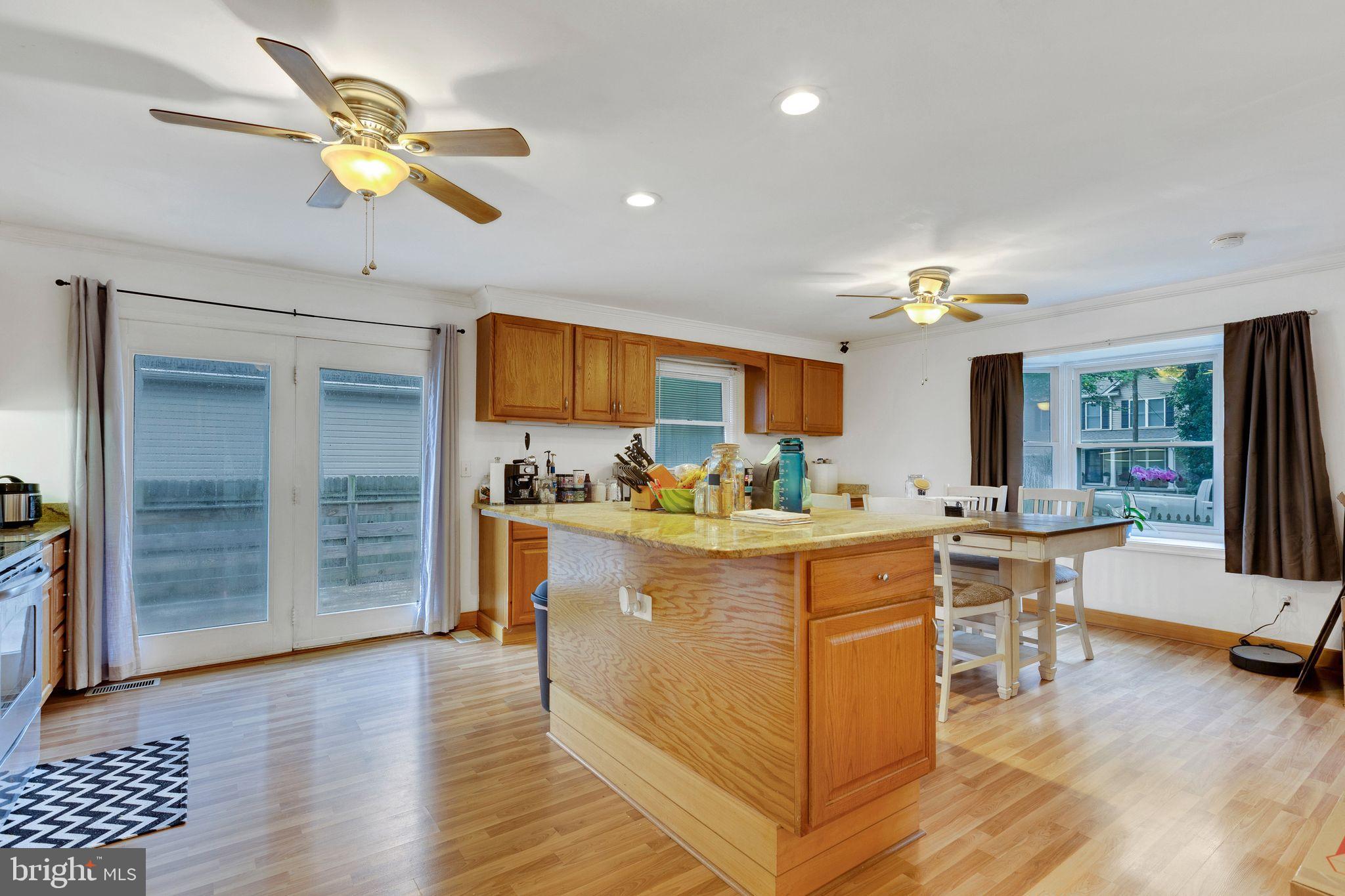 128 7th Street Colonial Beach, VA 22443 - Photo 9 of 32 a living room with stainless steel appliances furniture and a kitchen view