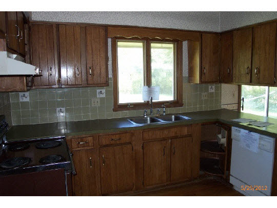 420 Rebecca Road Belvidere, IL 61008 - Photo 4 of 11 a kitchen with a sink a window and cabinets