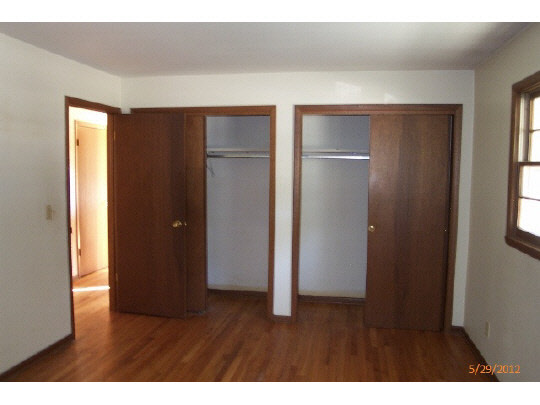 420 Rebecca Road Belvidere, IL 61008 - Photo 7 of 11 a view of an empty room with wooden floor and closet