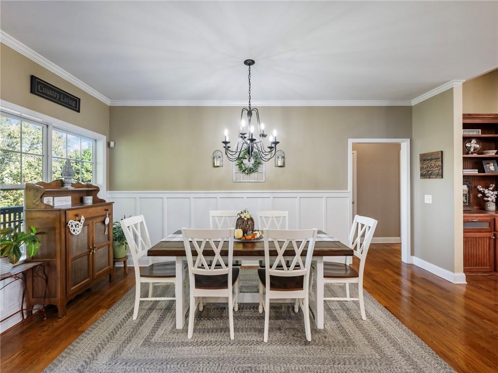 7657 Pea Ridge Road Lula, GA 30554 - Photo 14 of 76 a view of a dining room with furniture window and wooden floor