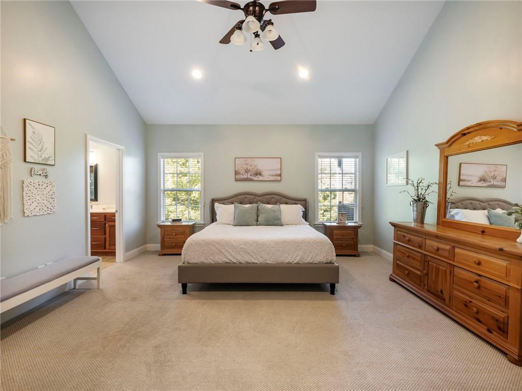 7657 Pea Ridge Road Lula, GA 30554 - Photo 17 of 76 a spacious bedroom with a bed and a dresser