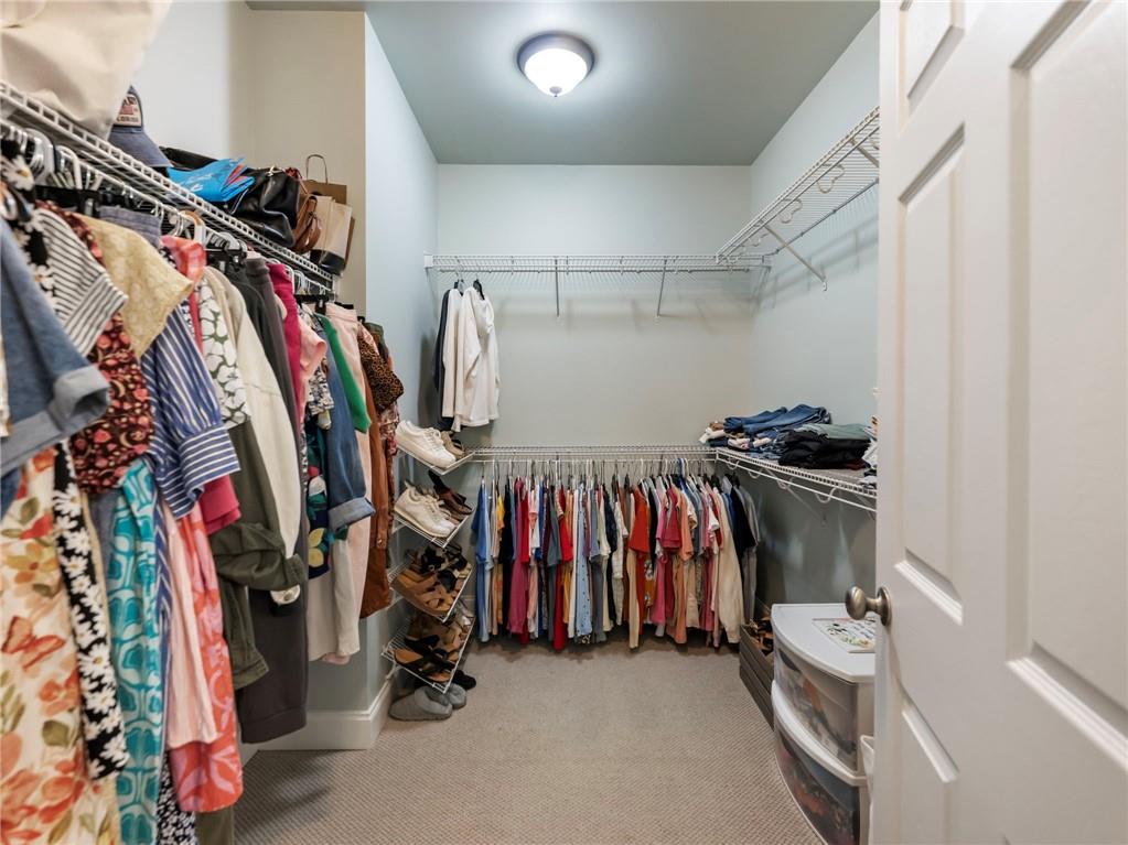7657 Pea Ridge Road Lula, GA 30554 - Photo 23 of 76 a view of walk in closet with clothes
