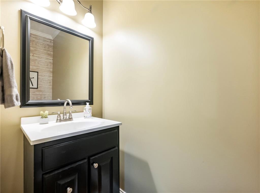 7657 Pea Ridge Road Lula, GA 30554 - Photo 26 of 76 a bathroom with a sink and a mirror