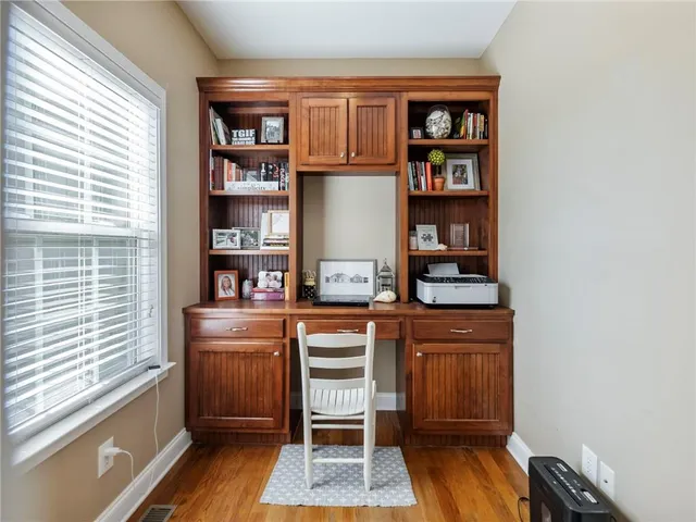 a living room with furniture a rug and a chandelier