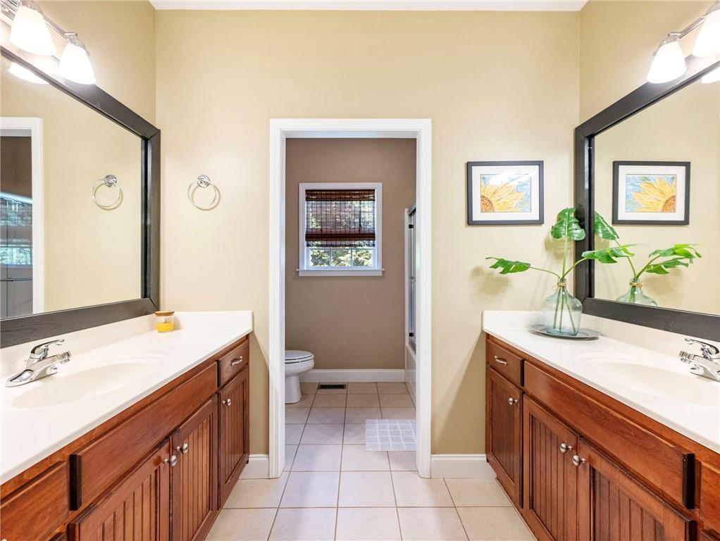 7657 Pea Ridge Road Lula, GA 30554 - Photo 34 of 76 a bathroom with a sink and a mirror