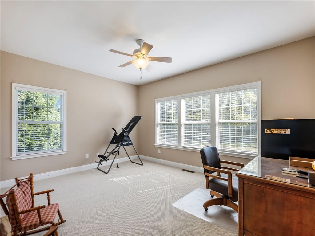 7657 Pea Ridge Road Lula, GA 30554 - Photo 36 of 76 a view of a workspace with furniture and a window