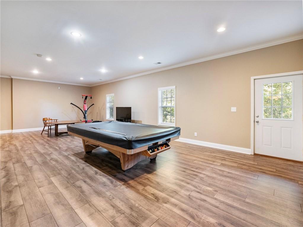 7657 Pea Ridge Road Lula, GA 30554 - Photo 44 of 76 a living room with furniture a rug and a wooden floor