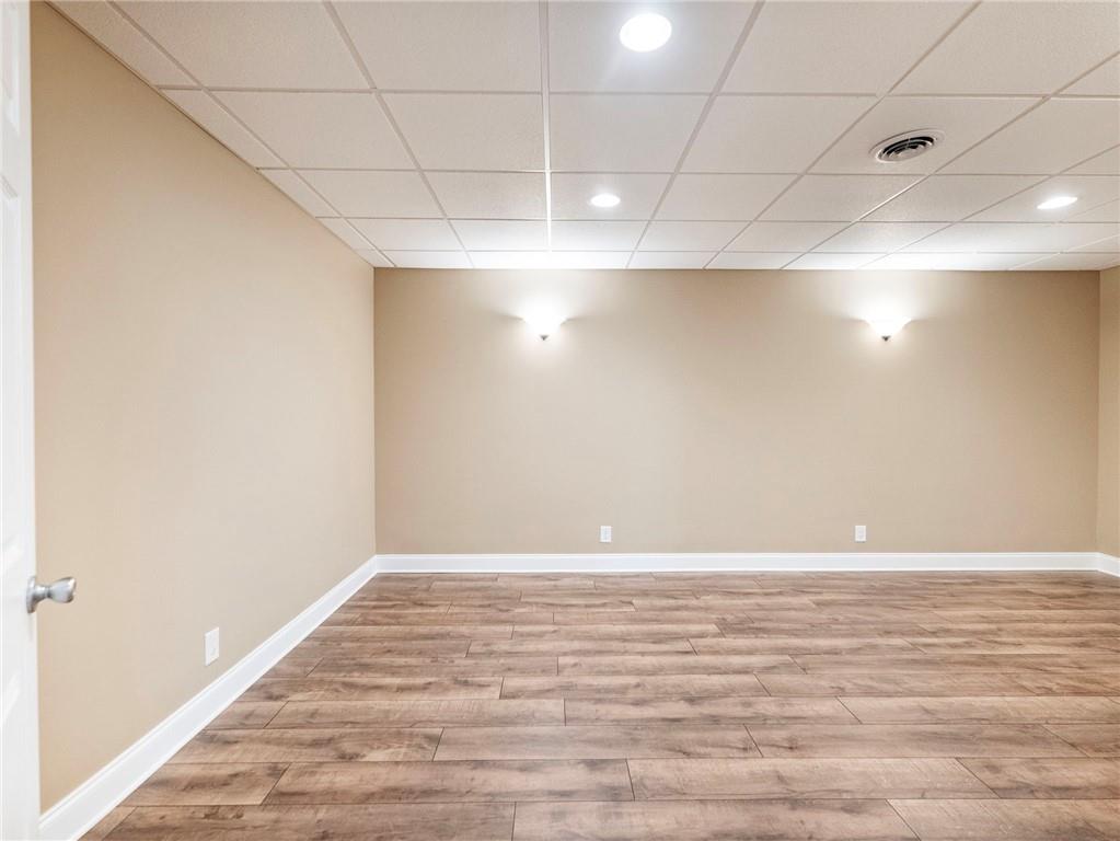 7657 Pea Ridge Road Lula, GA 30554 - Photo 45 of 76 a view of an empty room with wooden floor