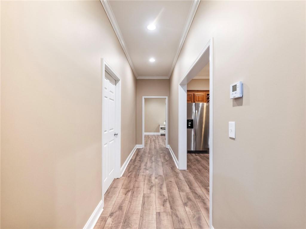 7657 Pea Ridge Road Lula, GA 30554 - Photo 47 of 76 a view of a hallway with wooden floor