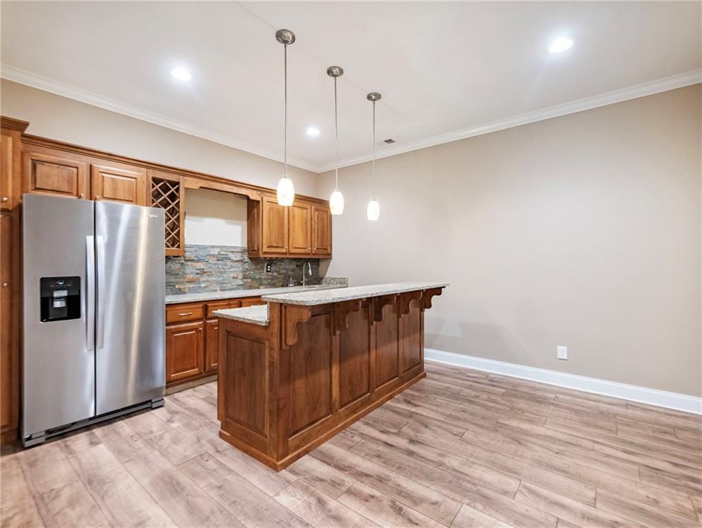 7657 Pea Ridge Road Lula, GA 30554 - Photo 48 of 76 a kitchen with stainless steel appliances granite countertop a refrigerator a oven and a sink with large countertops