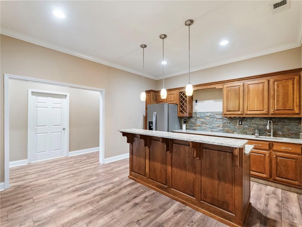7657 Pea Ridge Road Lula, GA 30554 - Photo 49 of 76 a kitchen with stainless steel appliances granite countertop a sink a stove and a wooden floors