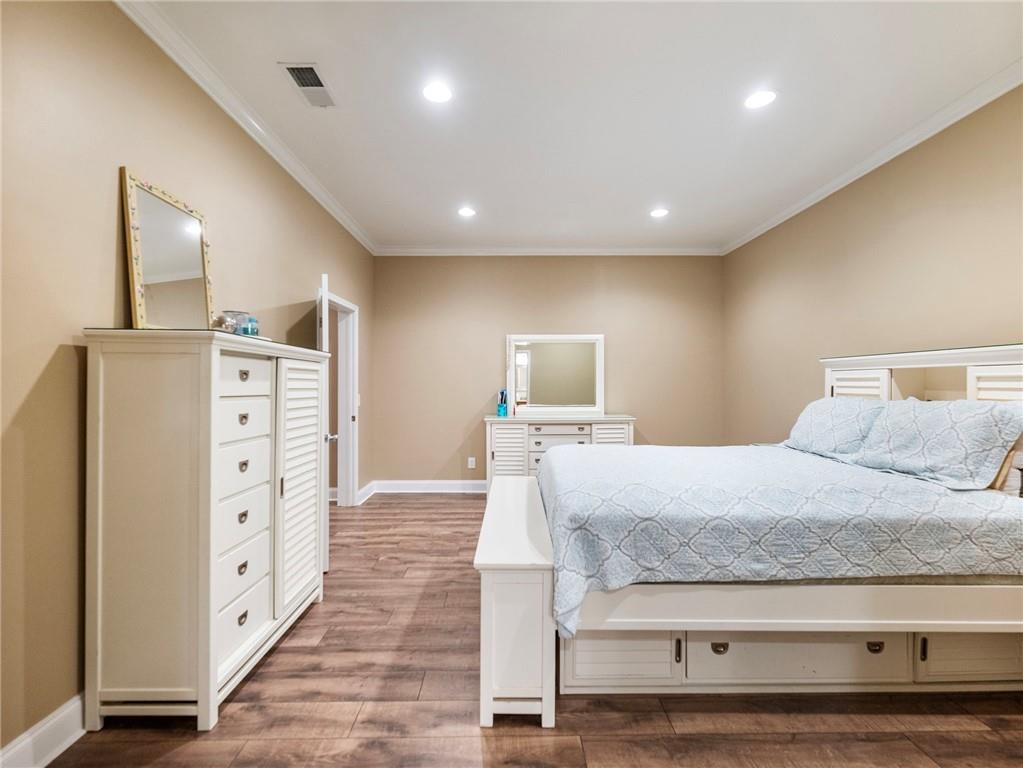 7657 Pea Ridge Road Lula, GA 30554 - Photo 53 of 76 a spacious bedroom with a bed and a view of living room