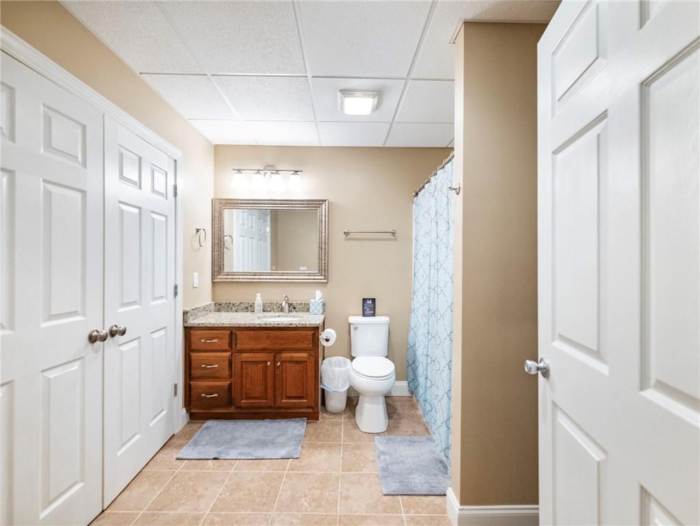 7657 Pea Ridge Road Lula, GA 30554 - Photo 54 of 76 a bathroom with a sink a toilet and shower