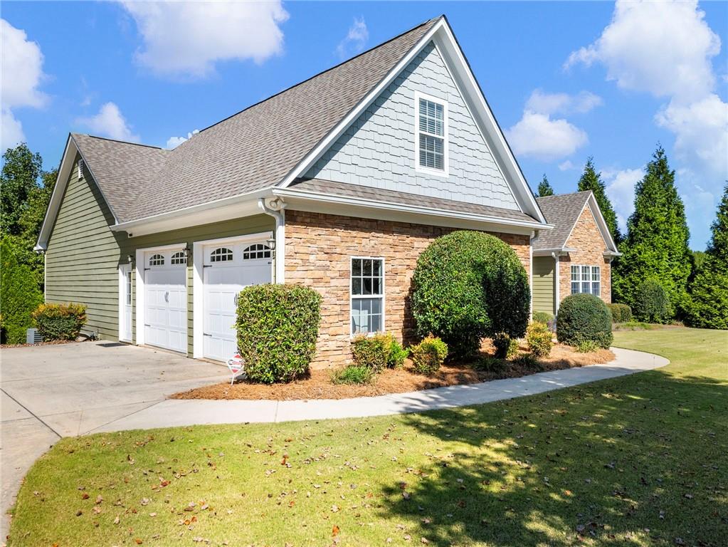 7657 Pea Ridge Road Lula, GA 30554 - Photo 58 of 76 a front view of a house with garden