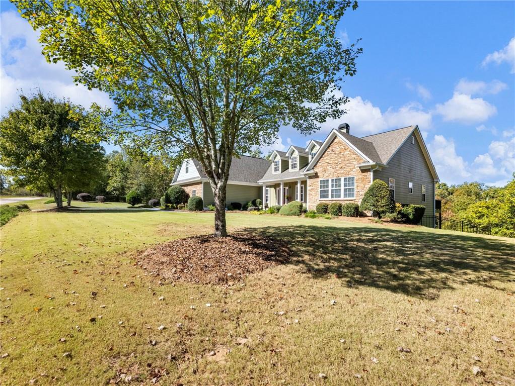 7657 Pea Ridge Road Lula, GA 30554 - Photo 59 of 76 a view of a house with a yard