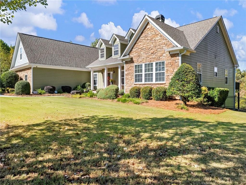 7657 Pea Ridge Road Lula, GA 30554 - Photo 60 of 76 a front view of a house with a yard