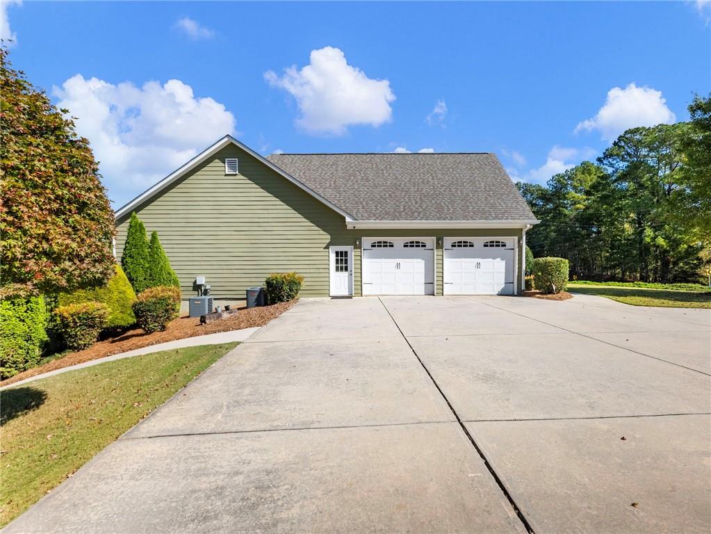 7657 Pea Ridge Road Lula, GA 30554 - Photo 61 of 76 a front view of a house with a yard and potted plants