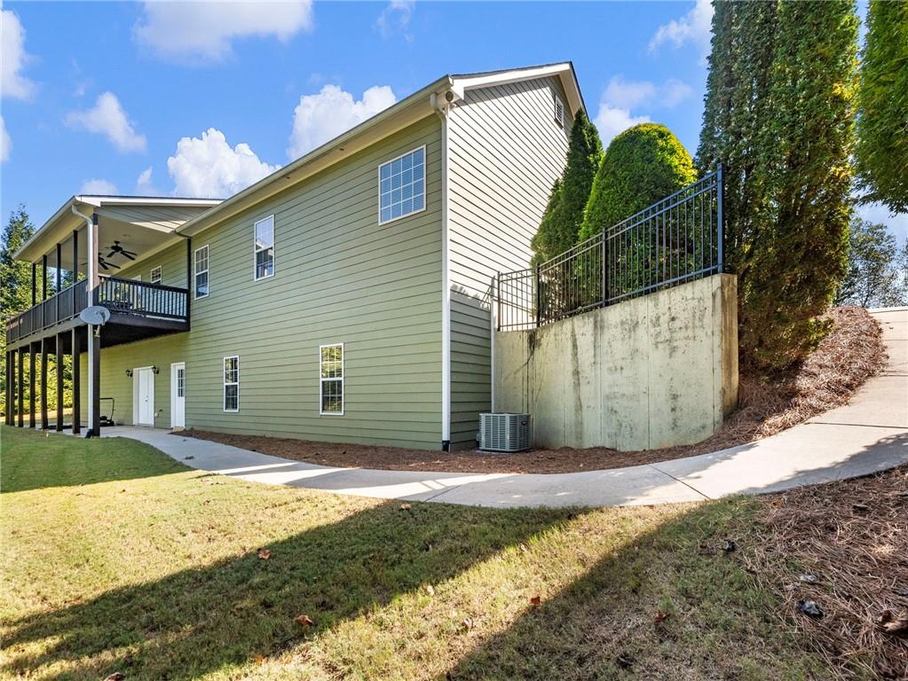 7657 Pea Ridge Road Lula, GA 30554 - Photo 63 of 76 a view of a house with backyard and tree