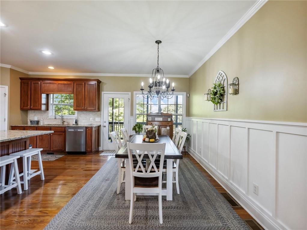 7657 Pea Ridge Road Lula, GA 30554 - Photo 9 of 76 a view of a dining room with furniture window and wooden floor