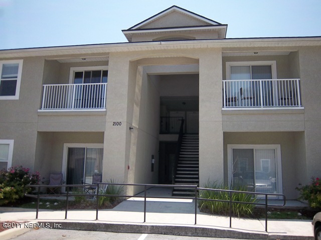 a front view of a house with garage