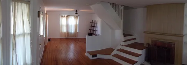 a view of entryway with wooden floor