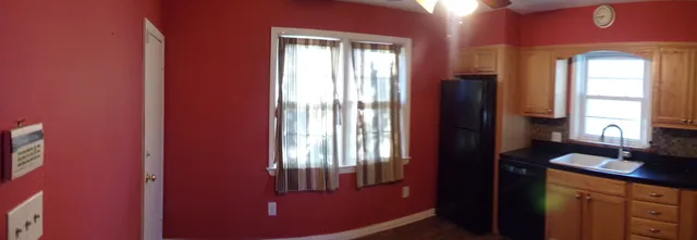 a view of a windows and an entryway in a livingroom