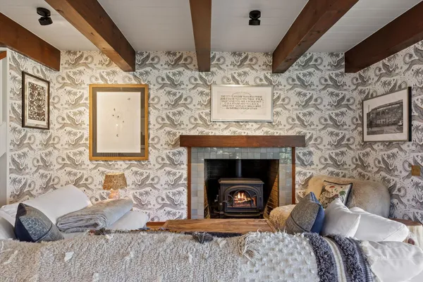 a bedroom with bed and a fireplace
