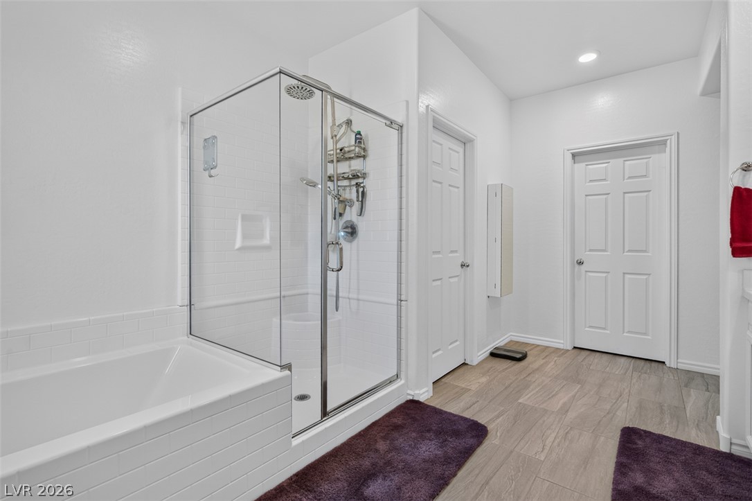 1824 Redland Ridge Street Henderson, NV 89002 - Photo 42 of 69 White subway tile accents a refreshing shower and tub combination.