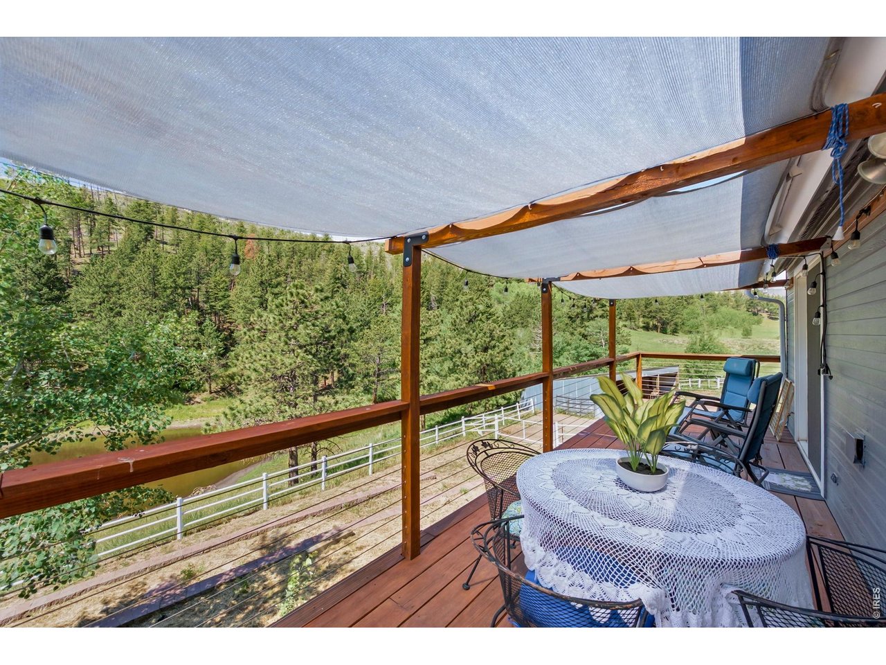 1154 Spring Valley Road Bellvue, CO 80512 - Photo 19 of 31 West facing deck that spans the length of the house.