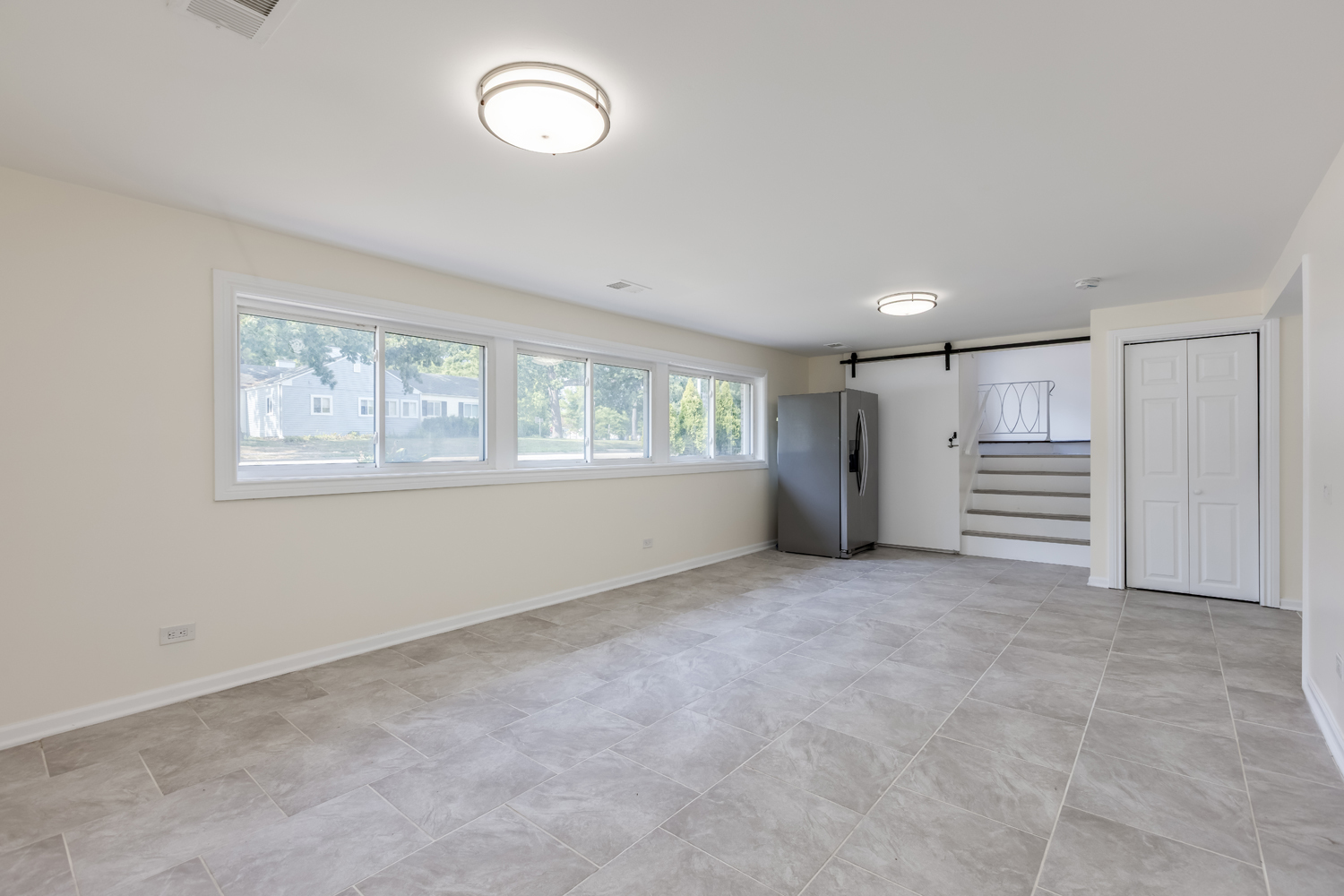 8717 Gross Point Road Skokie, IL 60077 - Photo 29 of 36 a view of an empty room with a window