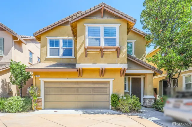 a front view of a house with a garage