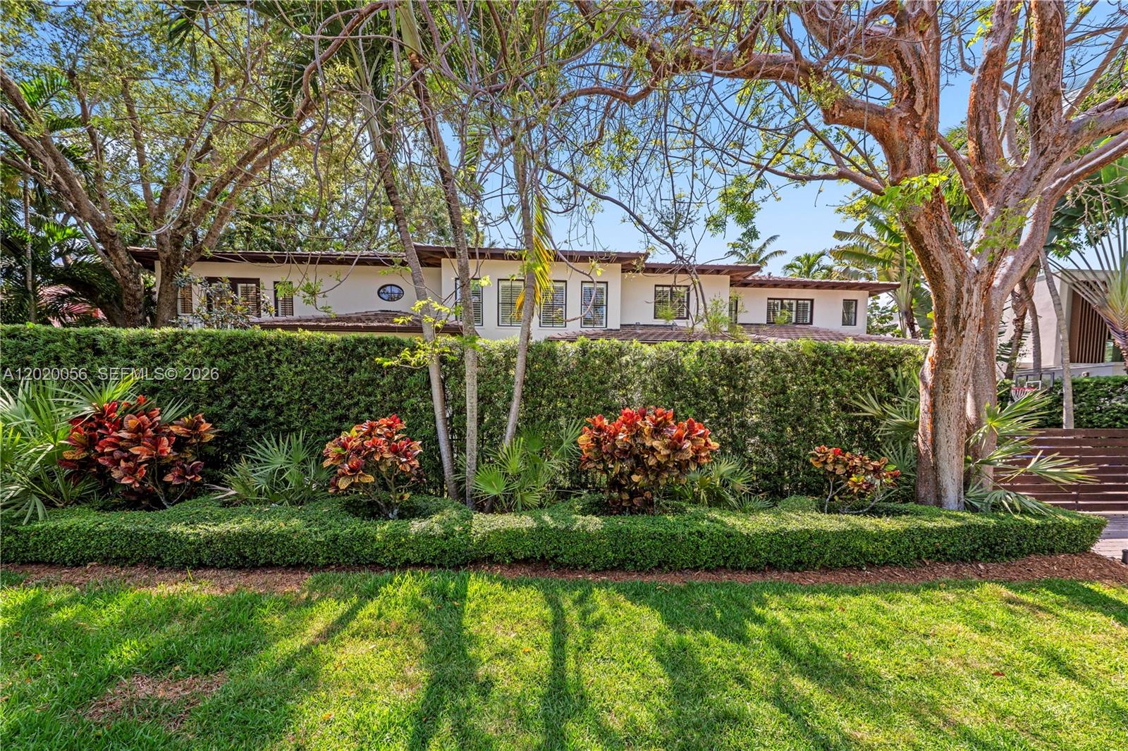 4196 Douglas Road Miami, FL 33133 - Photo 7 of 96 a front view of a house with a garden
