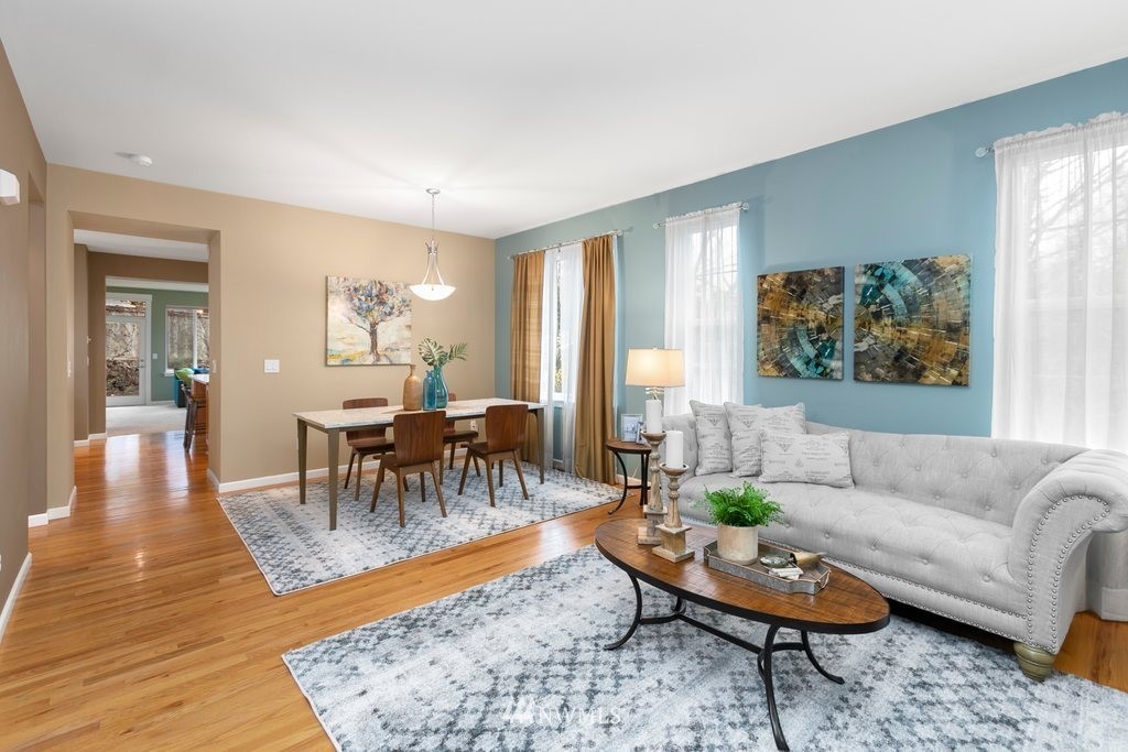 552 Mount Baker Place Northeast Renton, WA 98059 - Photo 2 of 25 a living room with furniture and a large window