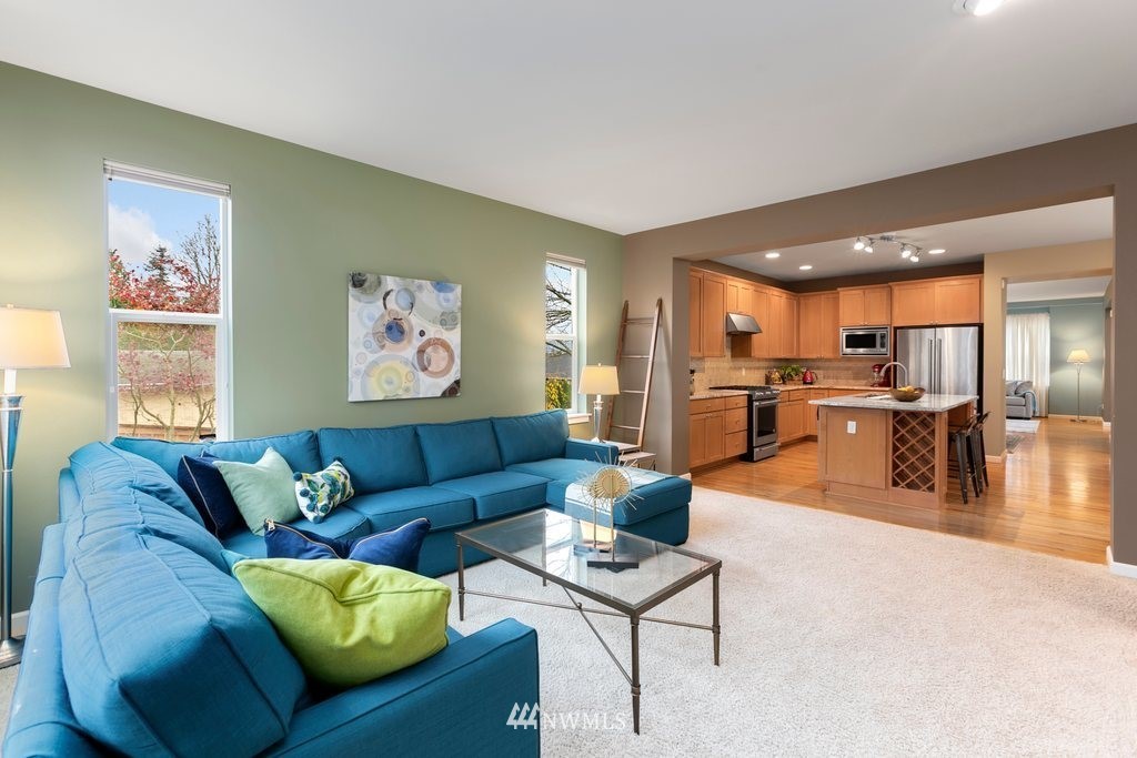 552 Mount Baker Place Northeast Renton, WA 98059 - Photo 11 of 25 a living room with furniture and a view of kitchen