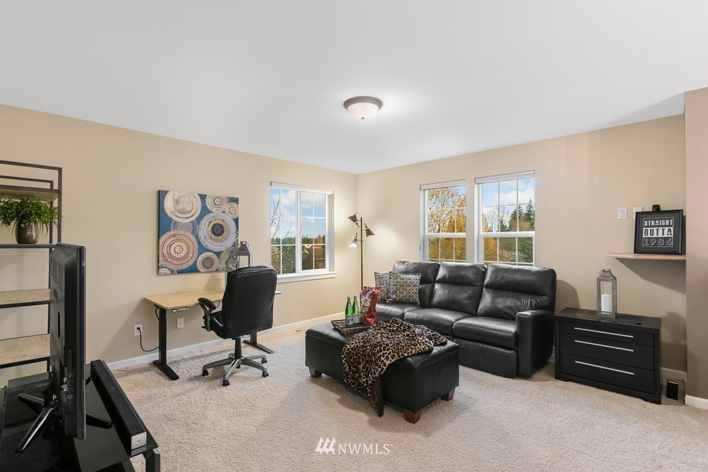 552 Mount Baker Place Northeast Renton, WA 98059 - Photo 21 of 25 a living room with furniture or couch and a window