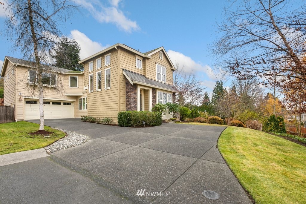552 Mount Baker Place Northeast Renton, WA 98059 - Photo 25 of 25 a view of a big house with a big yard and large tree