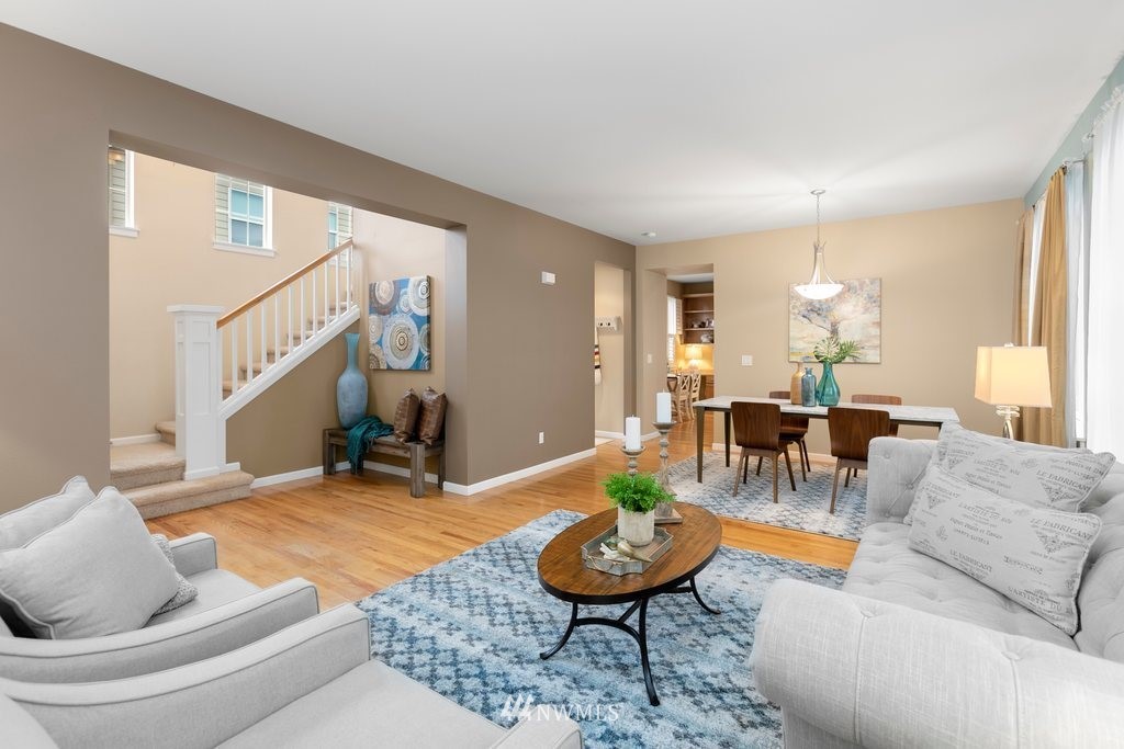 552 Mount Baker Place Northeast Renton, WA 98059 - Photo 5 of 25 a living room with furniture and a wooden floor