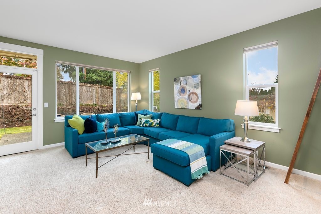 552 Mount Baker Place Northeast Renton, WA 98059 - Photo 9 of 25 a living room with furniture and a large window