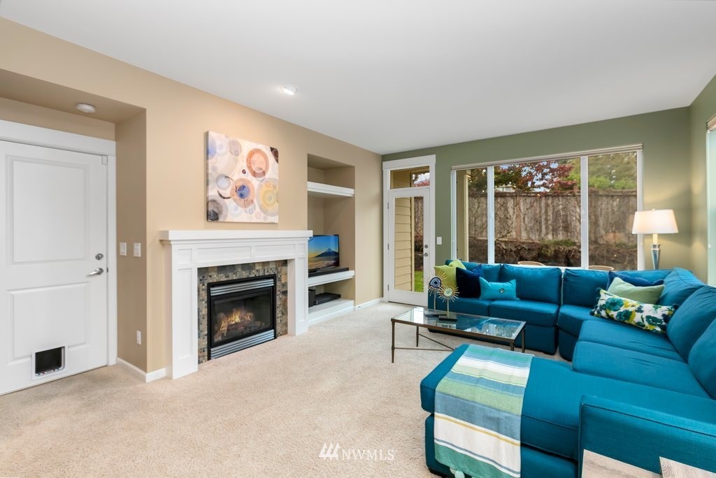 552 Mount Baker Place Northeast Renton, WA 98059 - Photo 10 of 25 a living room with furniture and a fireplace