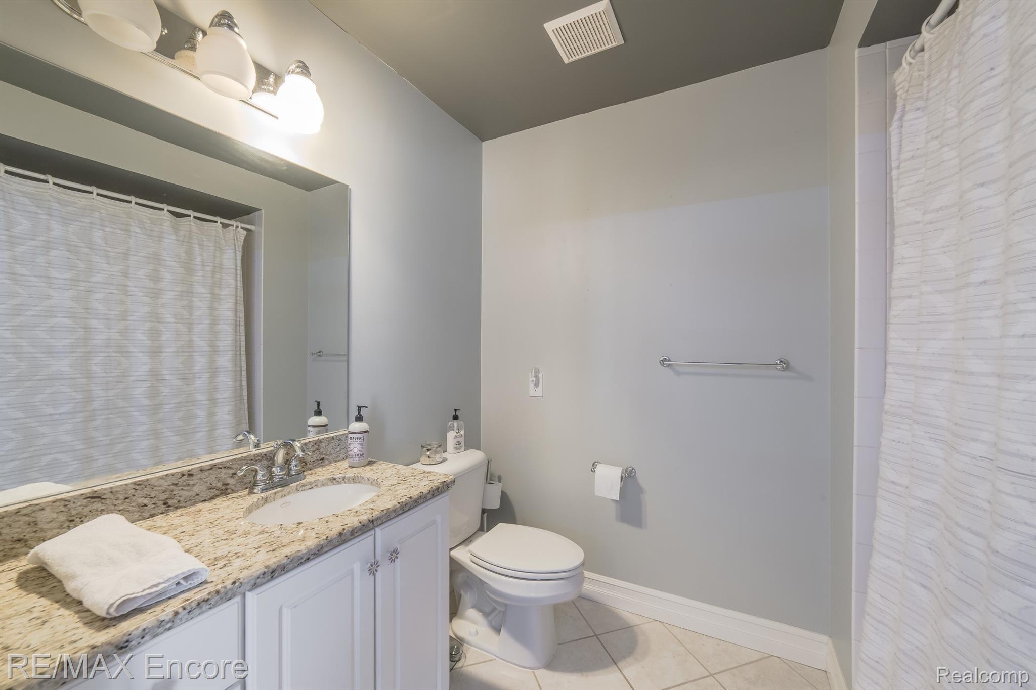 7686 Devins Ridge Clarkston, MI 48348 - Photo 34 of 58 Spacious bath with granite and large vanity and ceramic tile flooring