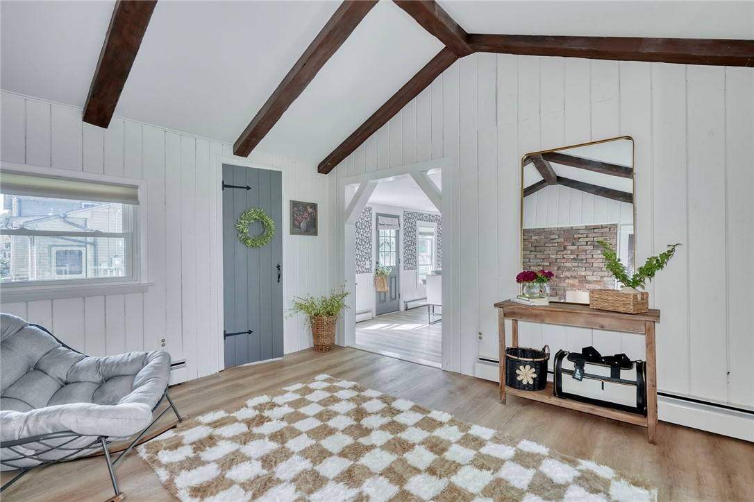 1023 Brown Road Irondequoit, NY 14622 - Photo 21 of 46 Vaulted bonus room with beams, brick wall, and sli