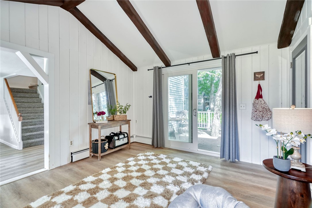 1023 Brown Road Irondequoit, NY 14622 - Photo 24 of 46 Vaulted bonus room with beams, brick wall, and sli