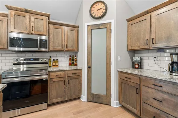 $430,000 | 1404 Northwest Maple Drive, Grain Valley, MO 64029