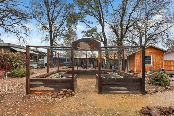 a view of a backyard with a sitting area