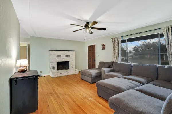 a living room with furniture and a fireplace