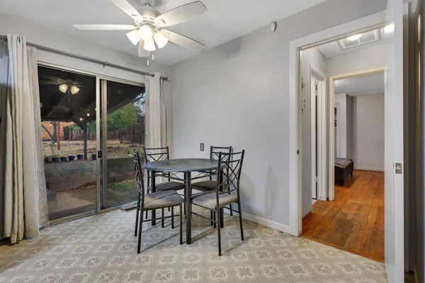 a view of a dining room with furniture window and outside view
