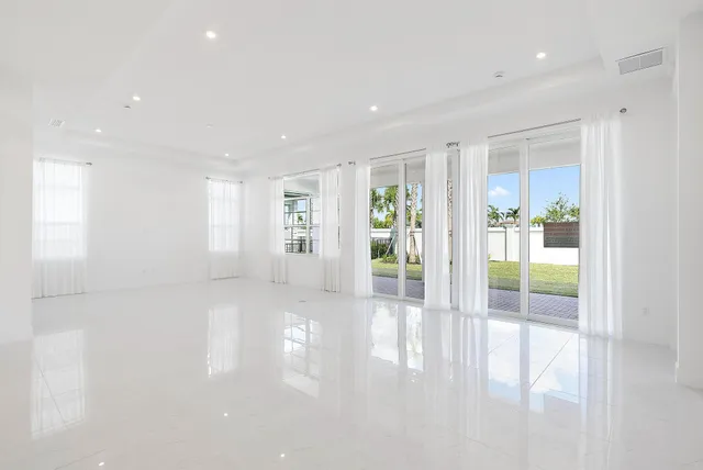 a view of an empty room and a window