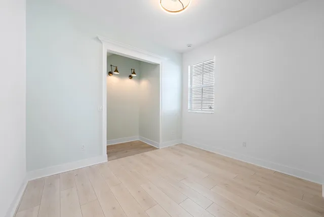 a view of a livingroom with a ceiling fan and window