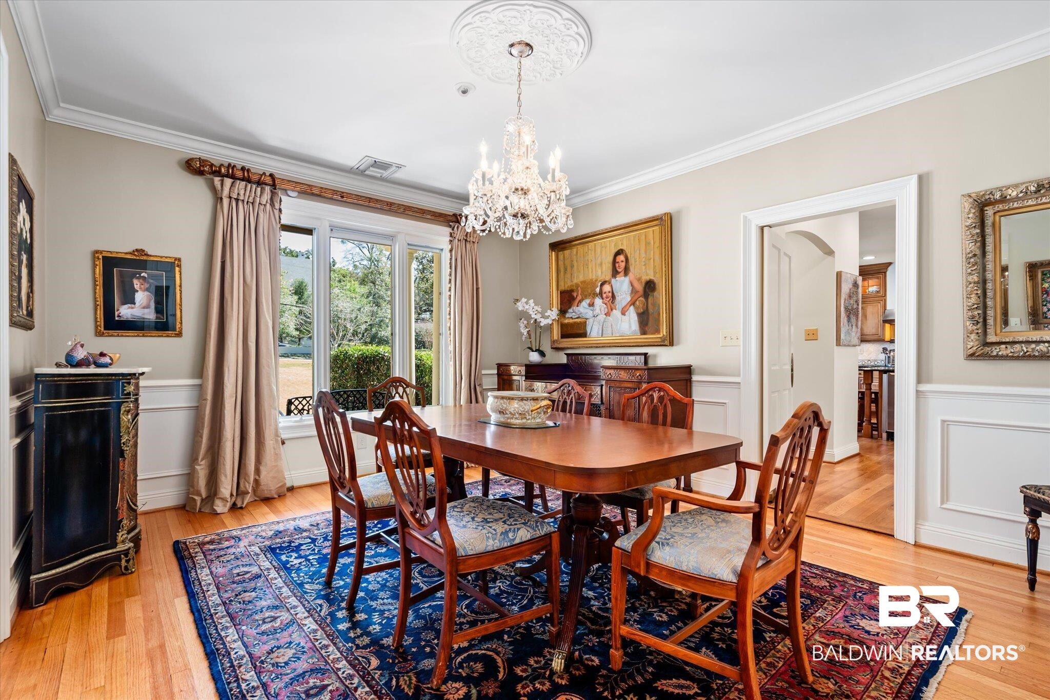 4 Kingsway Mobile, AL 36608 - Photo 7 of 44 Dining room featuring a chandelier, light wood finished floors, and crown molding